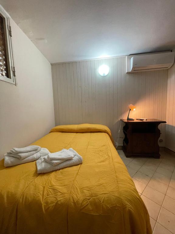 A bed or beds in a room at Normanni Central House