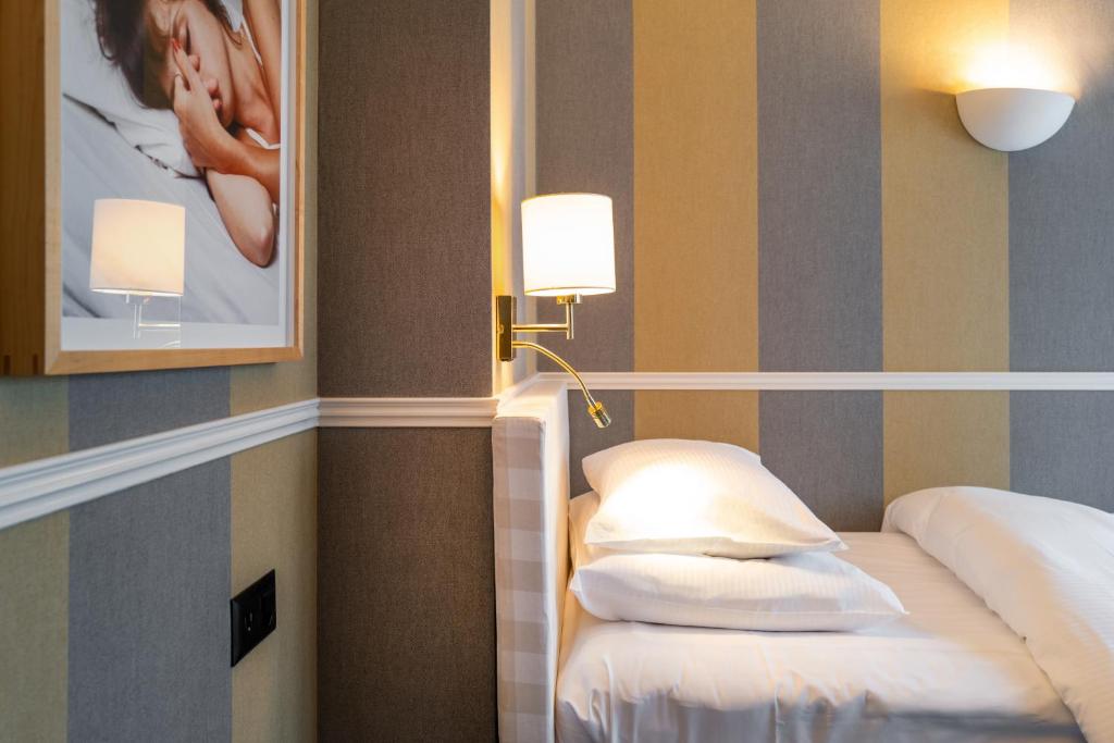 Postel nebo postele na pokoji v ubytování Hotel Kindli