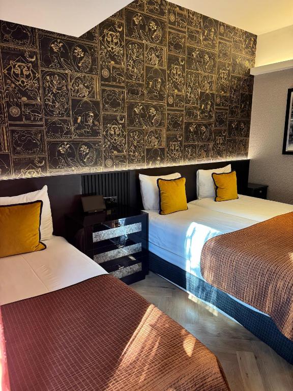 Postel nebo postele na pokoji v ubytování Hotel Sebastians