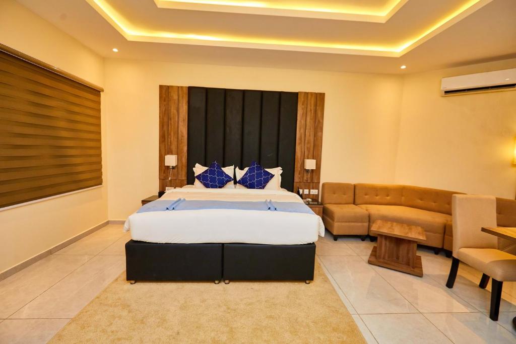 Postel nebo postele na pokoji v ubytování Vintano Hotel