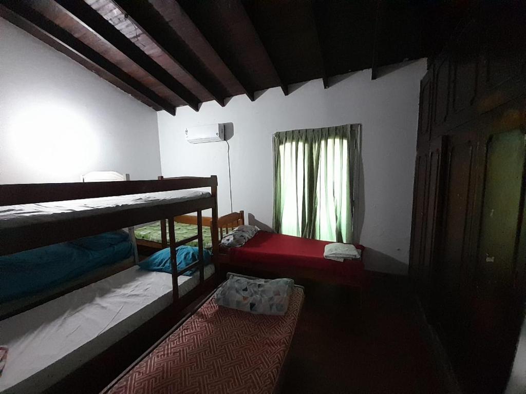 Postel nebo postele na pokoji v ubytování Hospedaje Quintana