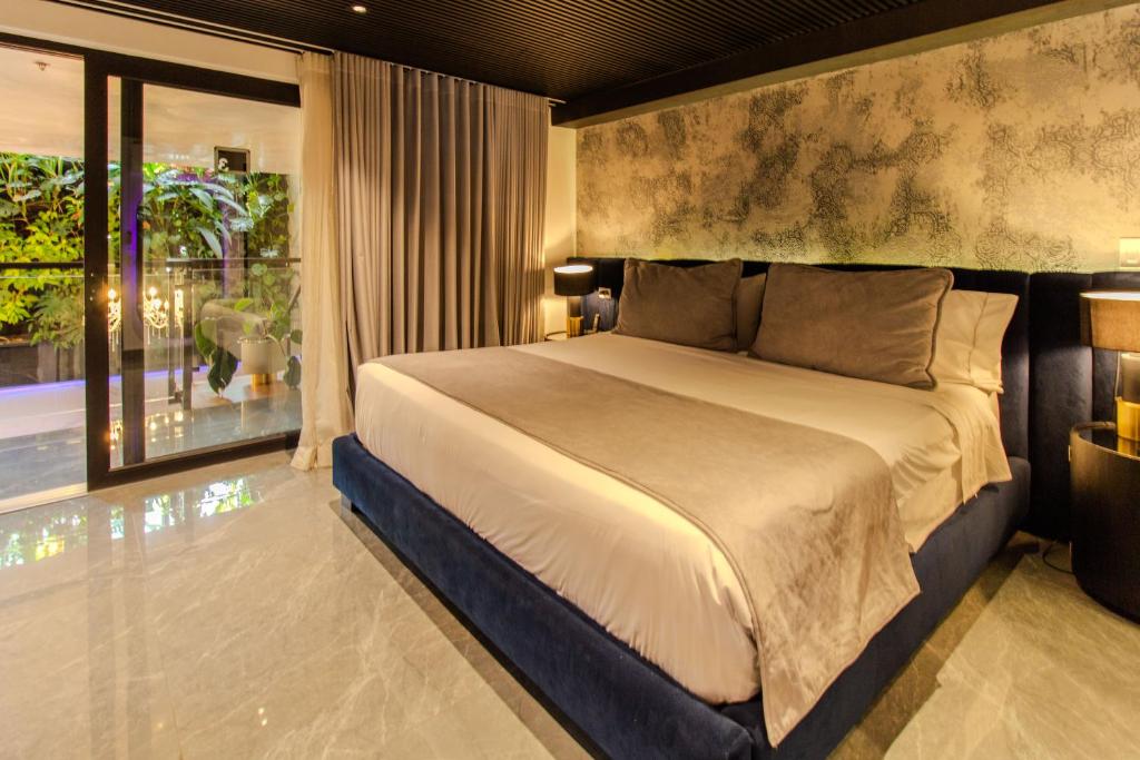 Postel nebo postele na pokoji v ubytování Haven A Design Hotel