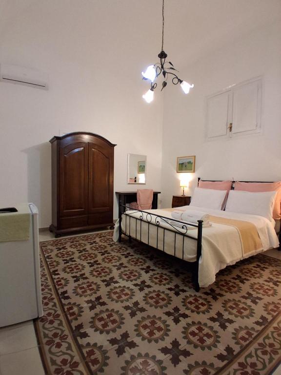 Postel nebo postele na pokoji v ubytování BnB '900 Lecce centro