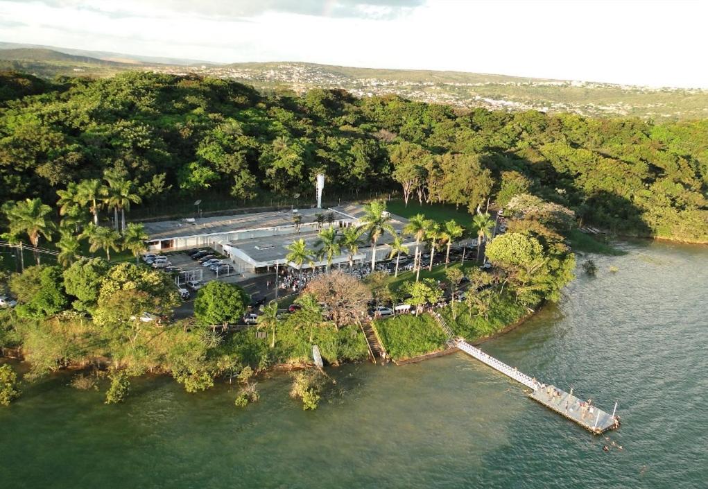 an aerial view of an island in the water at Grande Lago Hotel Gastronomia Bar in Três Marias