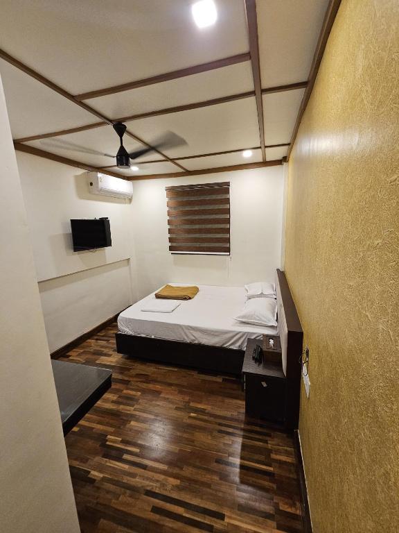 Postel nebo postele na pokoji v ubytování Chilambukadan Residency