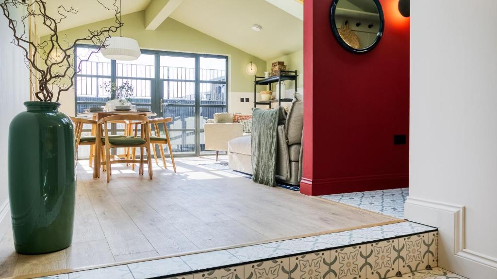 a living room with a vase on the floor at 49 Wexham in Beaumaris