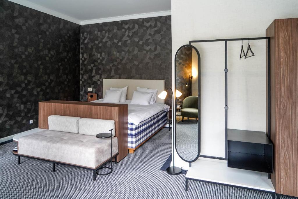 Postel nebo postele na pokoji v ubytování Central Park Voorburg - Relais & Chateaux