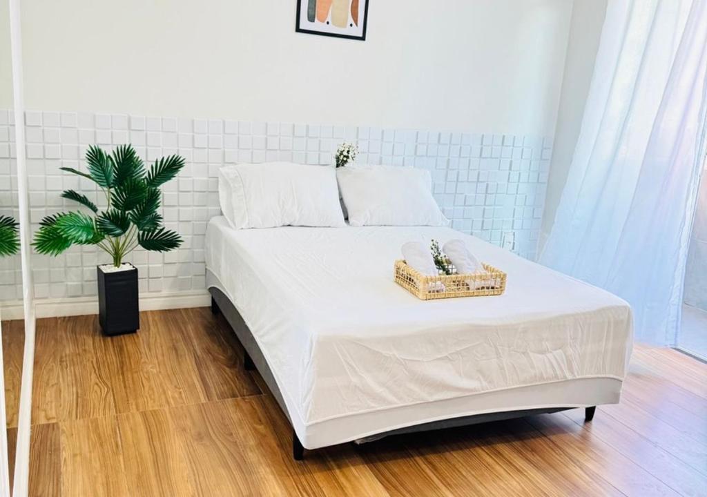 Ένα ή περισσότερα κρεβάτια σε δωμάτιο στο Casa Pitaya - Espaçoso Apto 2 min da Praia do Forte, Cabo Frio