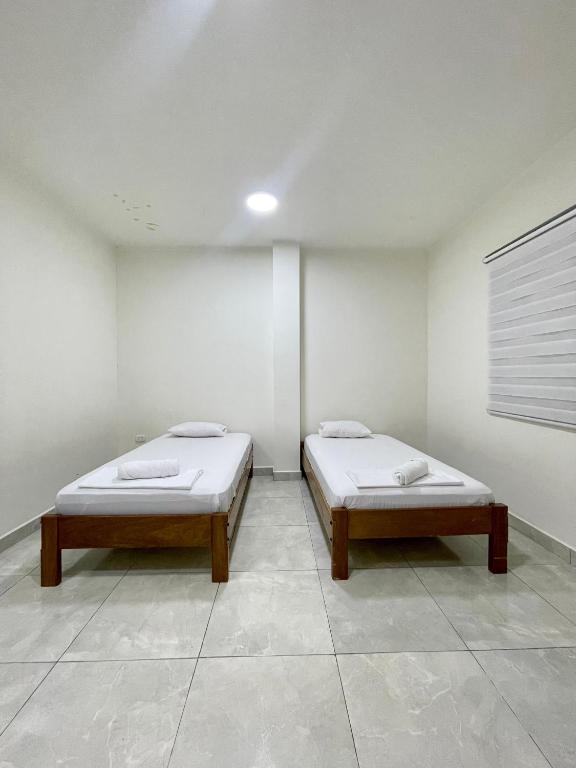 Postel nebo postele na pokoji v ubytování Iquitos House