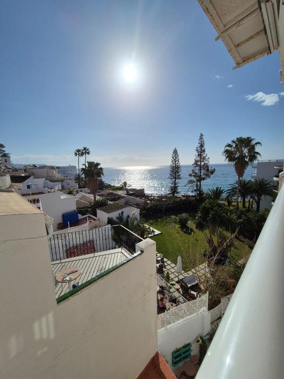 a view of the ocean from a balcony of a building at 3ºB Escobar in Nerja