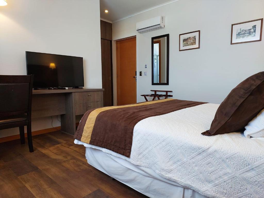 TV a/nebo společenská místnost v ubytování Conrado Hotel Osorno