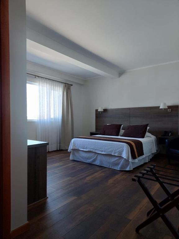 Postel nebo postele na pokoji v ubytování Conrado Hotel Osorno