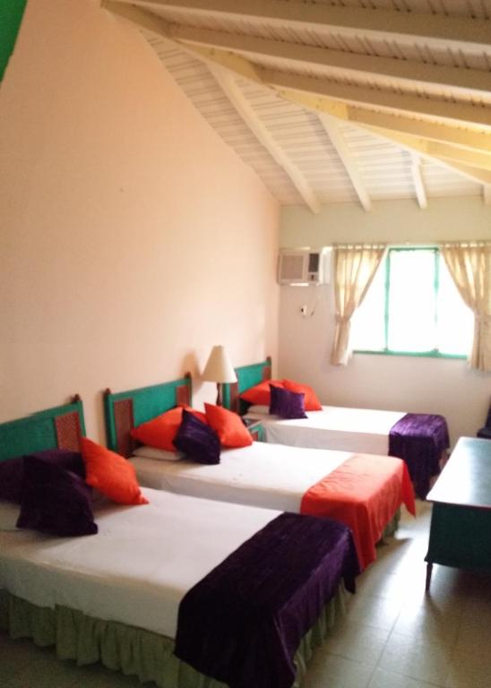 Postel nebo postele na pokoji v ubytování Hosteria Canoa