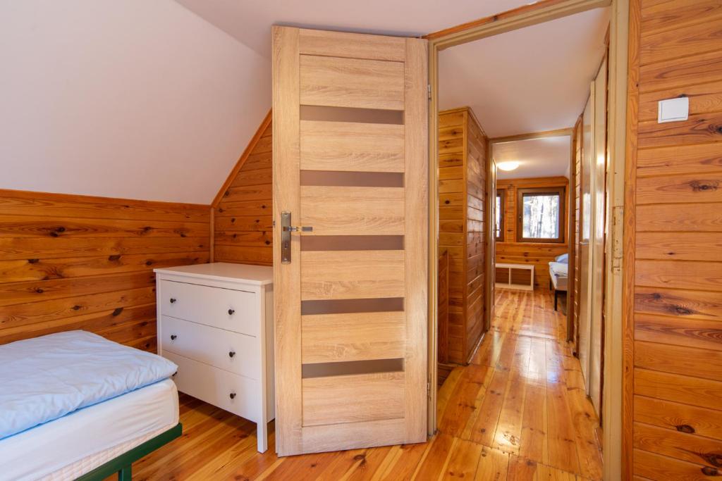 Postel nebo postele na pokoji v ubytování Sława Family Resort