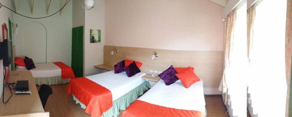 Postel nebo postele na pokoji v ubytování Hosteria Canoa