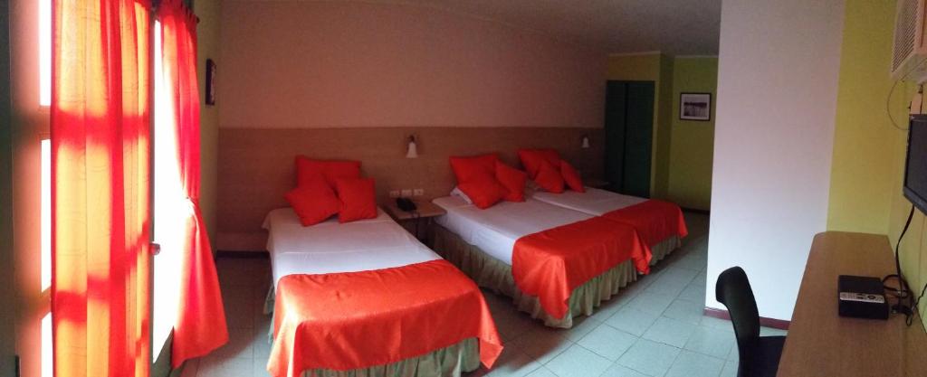 Postel nebo postele na pokoji v ubytování Hosteria Canoa