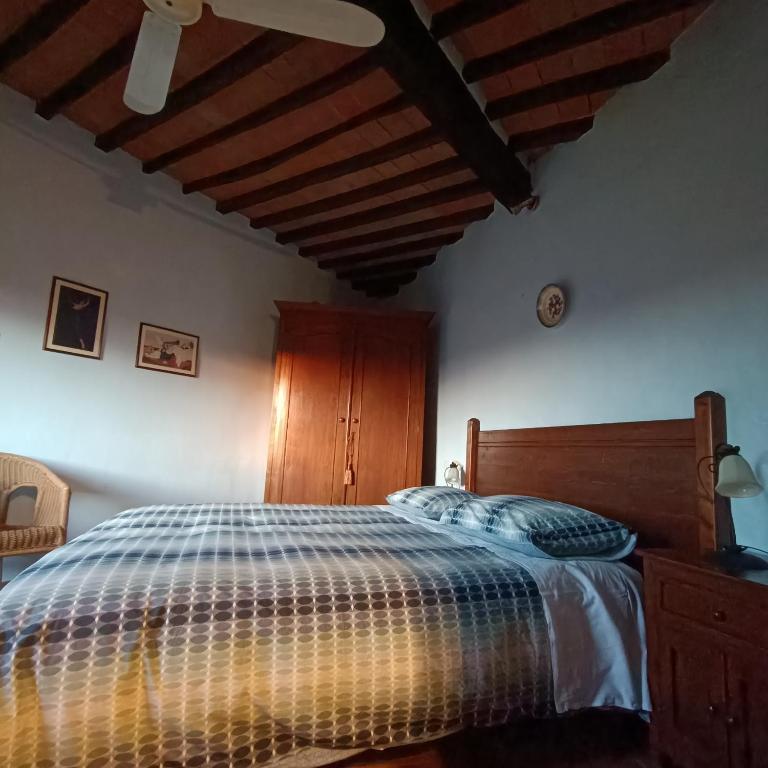 Postel nebo postele na pokoji v ubytování Ghigo La Locanda di Torquato
