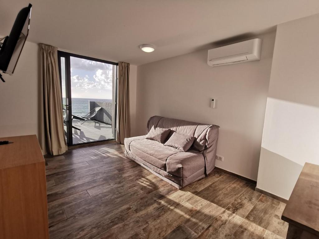 TV a/nebo společenská místnost v ubytování Village de vacances Paese di Lava, Grand Ajaccio