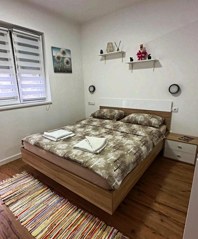 Postel nebo postele na pokoji v ubytování Apartman Sidro