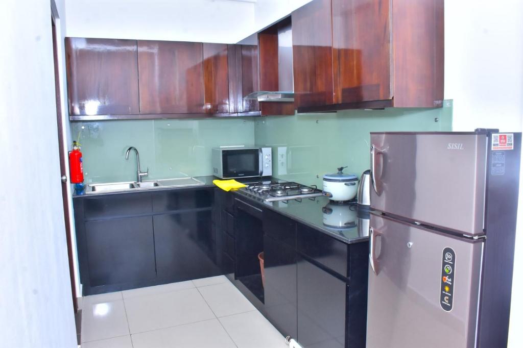 Kuchyň nebo kuchyňský kout v ubytování Lotus Luxe Residences