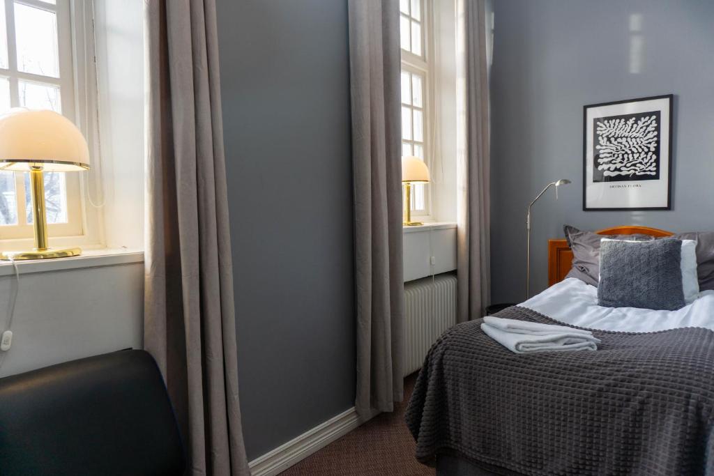 Postel nebo postele na pokoji v ubytování Furunäset Hotell & Konferens