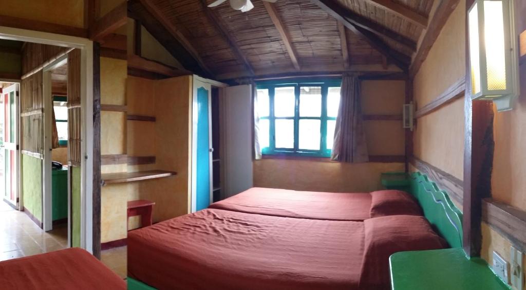 Postel nebo postele na pokoji v ubytování Hosteria Canoa