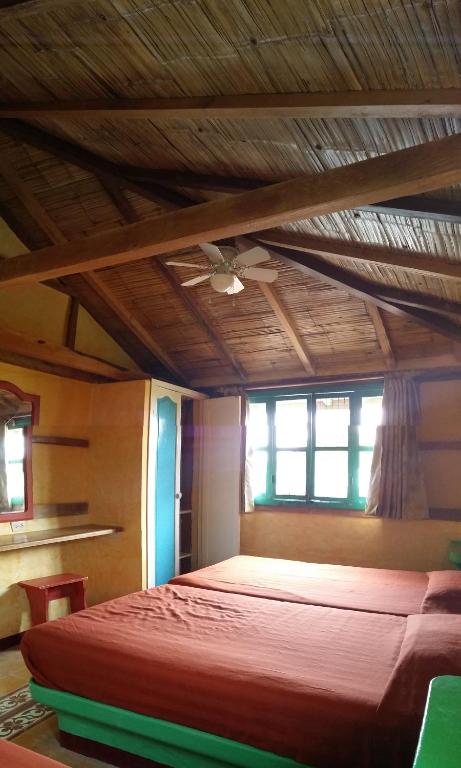 Postel nebo postele na pokoji v ubytování Hosteria Canoa