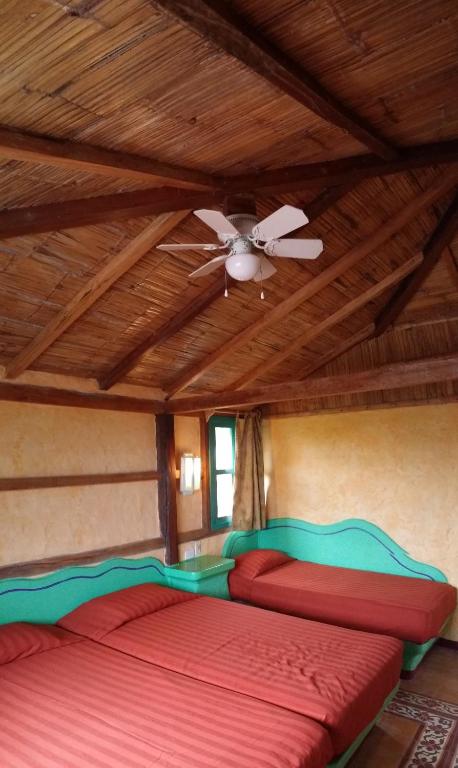 Postel nebo postele na pokoji v ubytování Hosteria Canoa