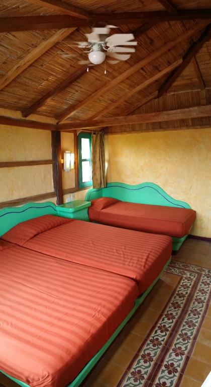 Postel nebo postele na pokoji v ubytování Hosteria Canoa
