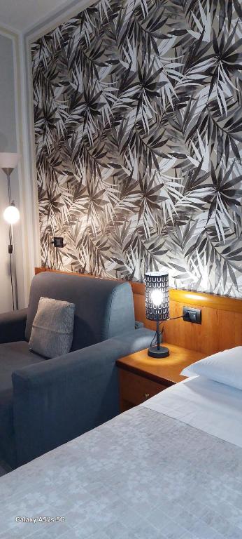 Cama o camas de una habitación en Hotel Alpi Resort