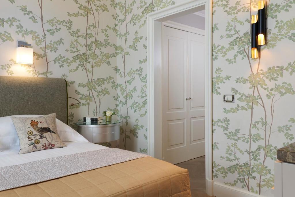 Postel nebo postele na pokoji v ubytování Rocco Forte Hotel Savoy