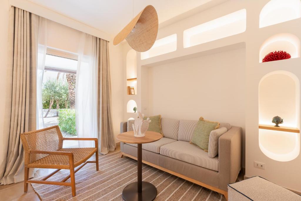 a living room with a couch and a table at Ostuni a Mare in Ostuni