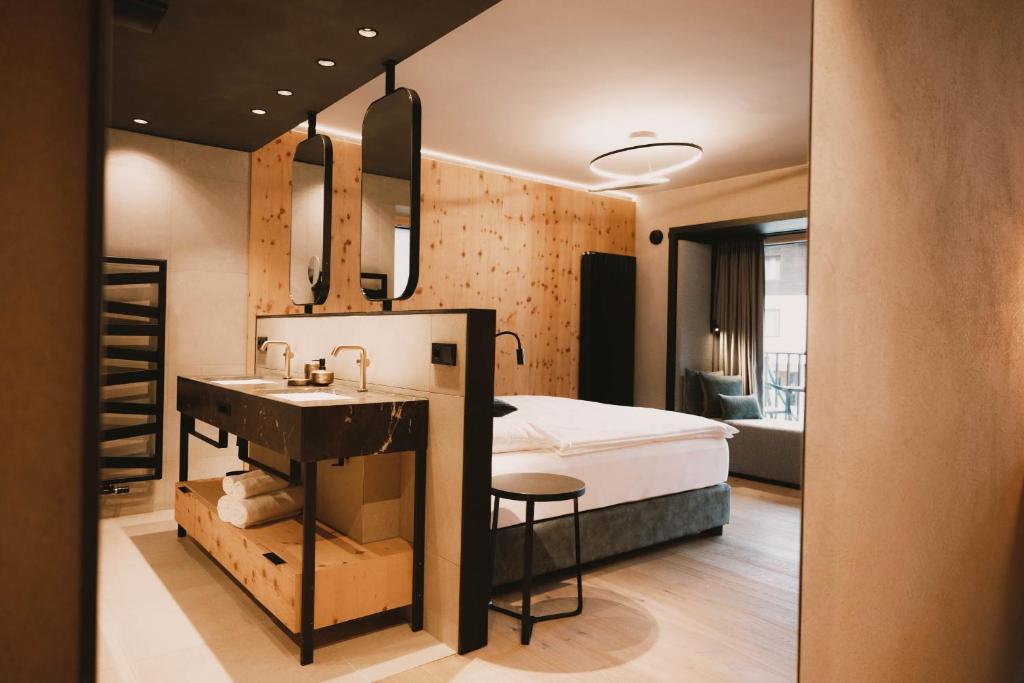 Postel nebo postele na pokoji v ubytování Familotel Kindl