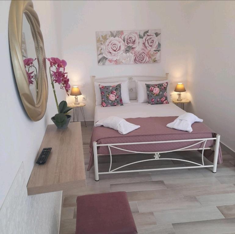 Ένα ή περισσότερα κρεβάτια σε δωμάτιο στο Loula's House