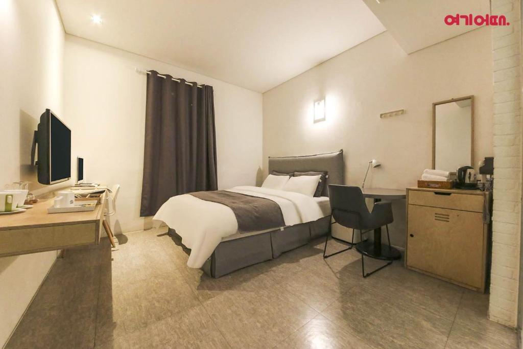 Postel nebo postele na pokoji v ubytování Ami Boutique Hotel, Yongin