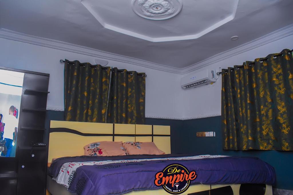 Postel nebo postele na pokoji v ubytování De Empire Hotel