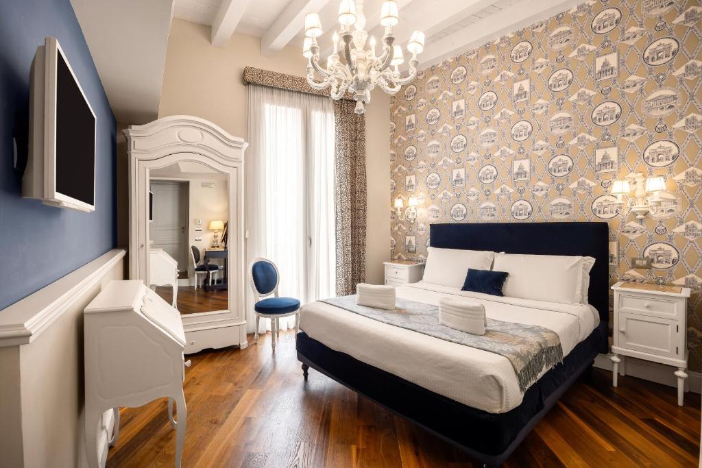 Ένα ή περισσότερα κρεβάτια σε δωμάτιο στο Dimora Bellini - Residenza d'Epoca