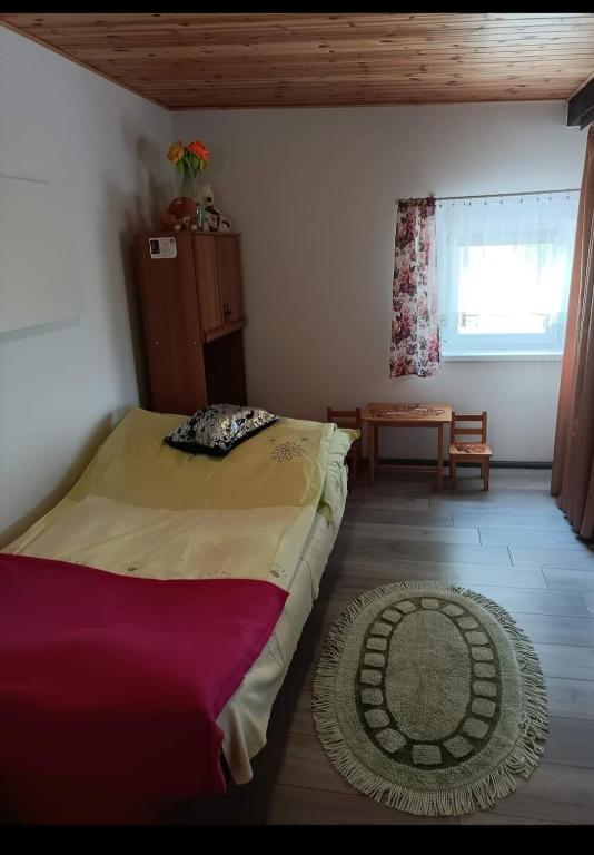 Posteľ alebo postele v izbe v ubytovaní Wczasy na Kaszubach u Hani