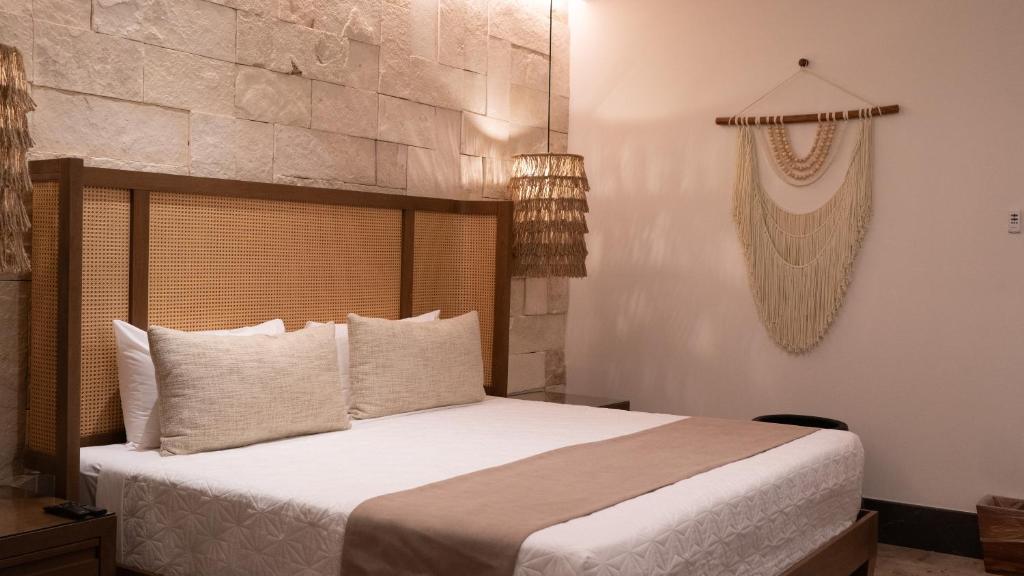 Postel nebo postele na pokoji v ubytování Hotel Mundo Maya Nuevo Uxmal