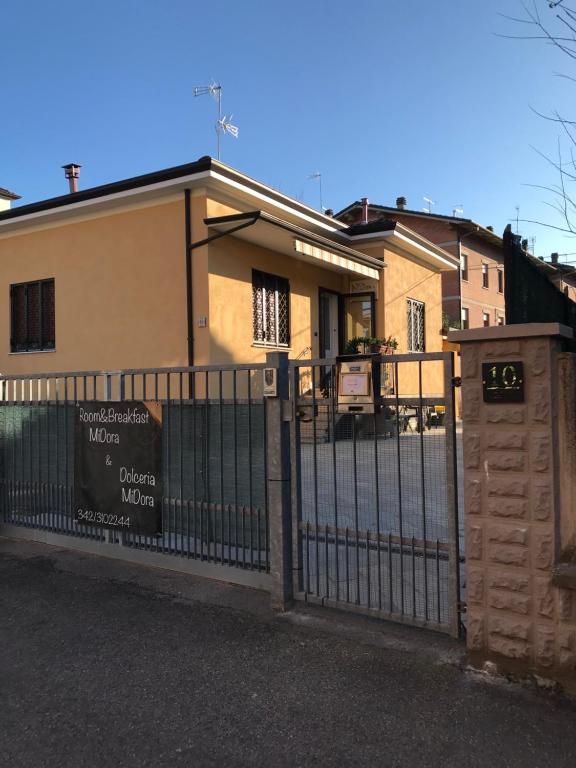 a house with a gate in front of it at R&B MiDora Montale in Montale