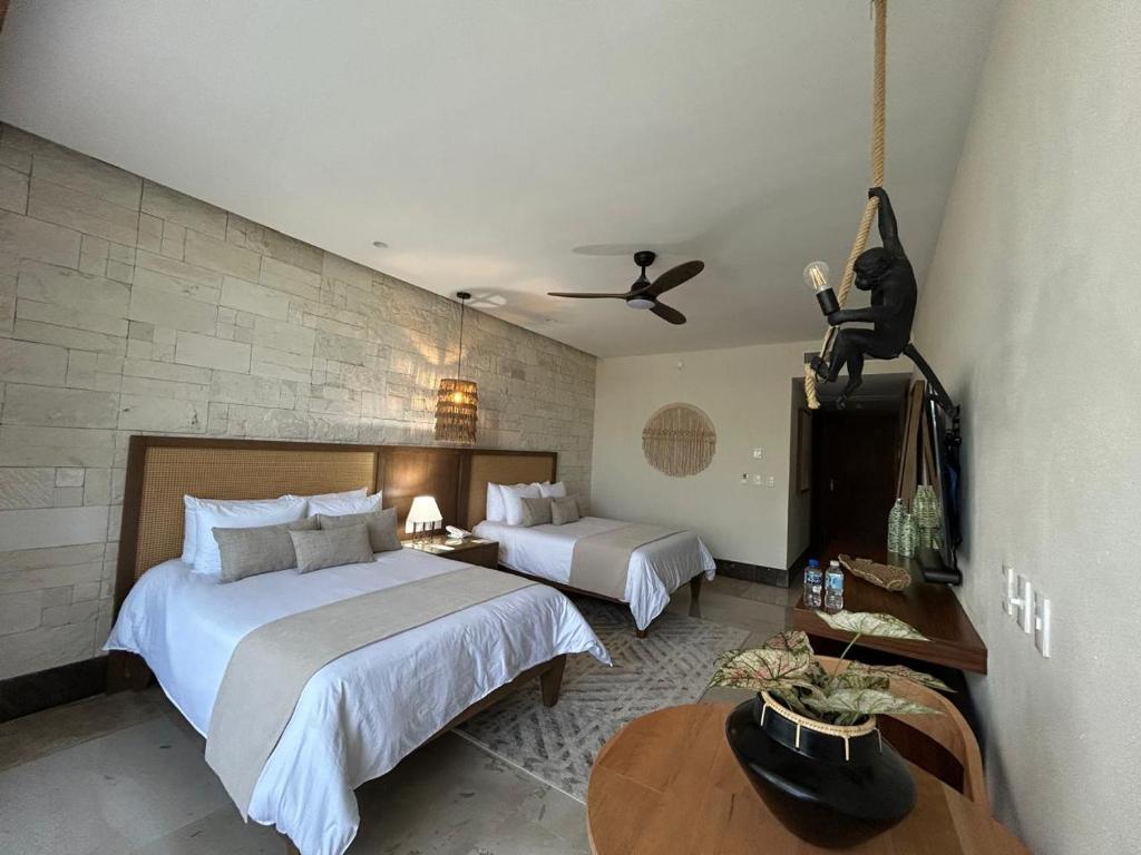 Postel nebo postele na pokoji v ubytování Hotel Mundo Maya Nuevo Uxmal