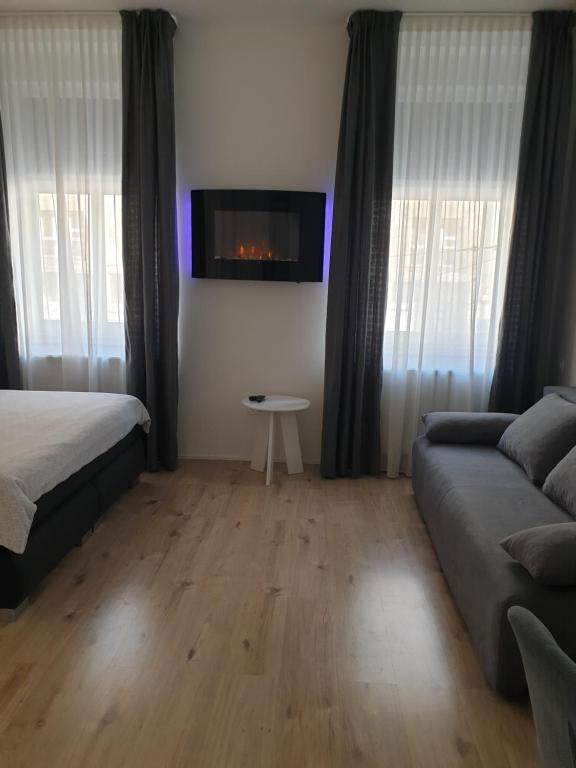 Posteľ alebo postele v izbe v ubytovaní City Center Main Square Apartments Zagreb