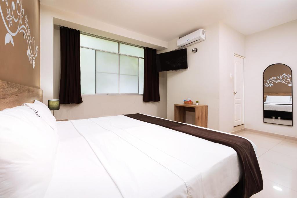 Voodi või voodid majutusasutuse Hotel Solec Piura toas