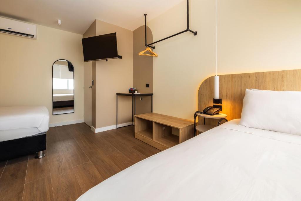 Voodi või voodid majutusasutuse Hotel Solec Piura toas