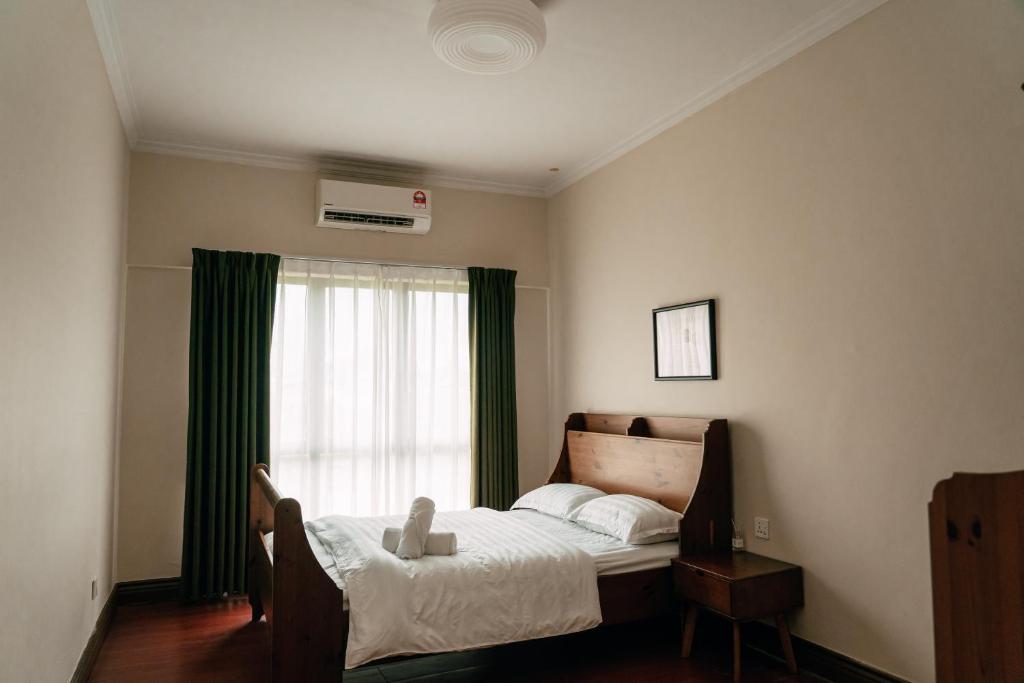 Postel nebo postele na pokoji v ubytování Gee homestay