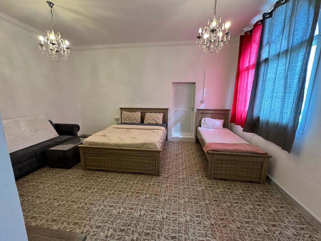 Postel nebo postele na pokoji v ubytování International Abu Dhabi Hostel