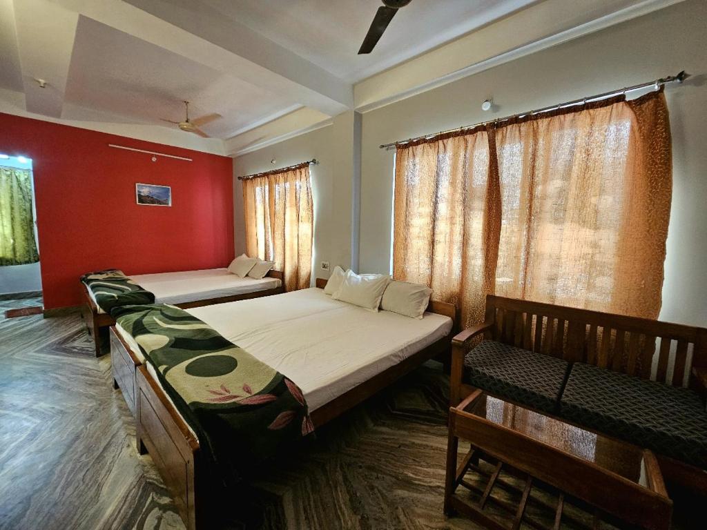 Postel nebo postele na pokoji v ubytování Hotel Vishal