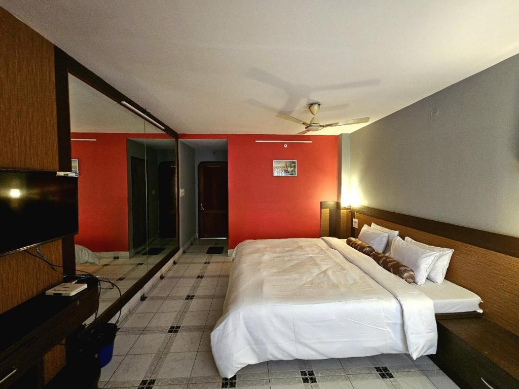 Postel nebo postele na pokoji v ubytování Hotel Vishal