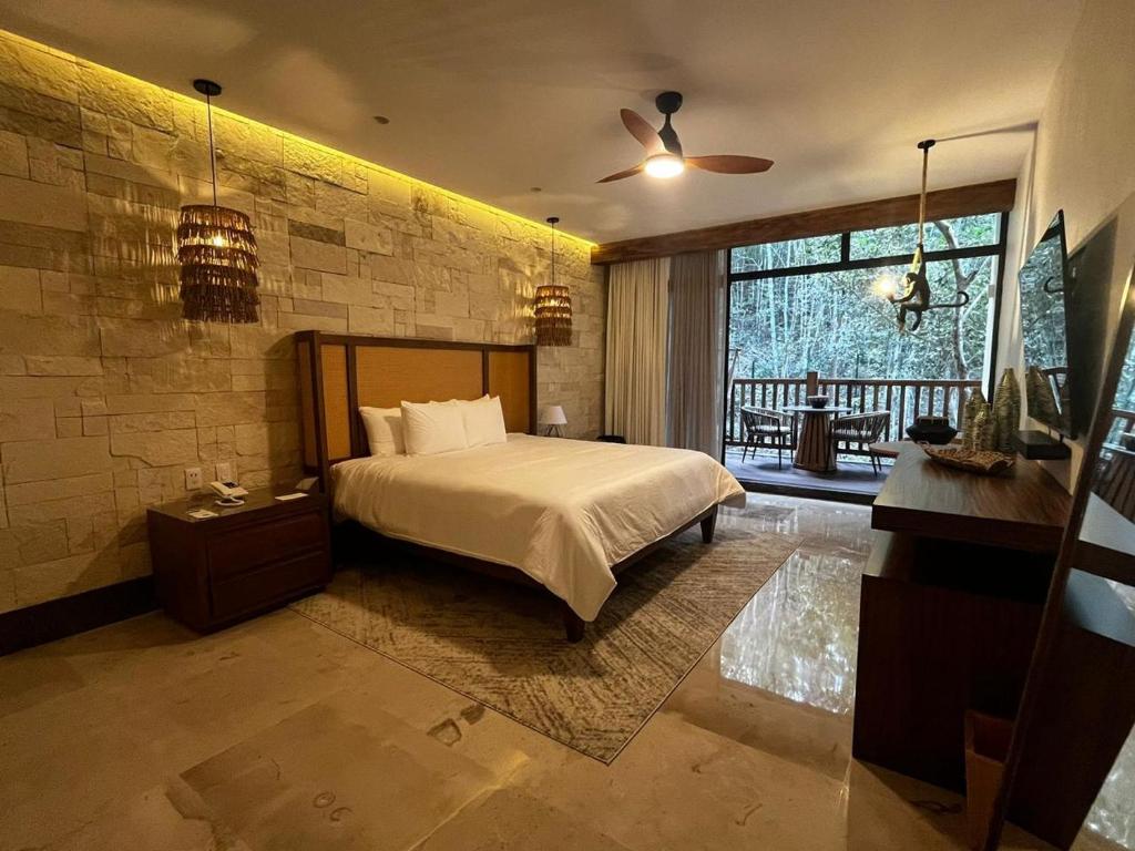 Postel nebo postele na pokoji v ubytování Hotel Mundo Maya Calakmul