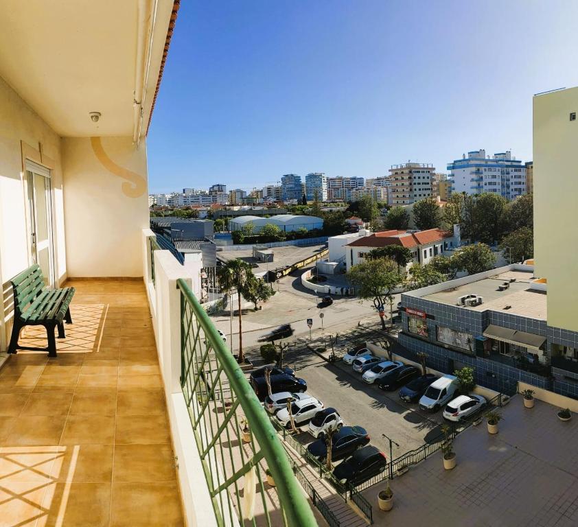 a balcony with a view of a parking lot at Welkome Inn Estádio T2 in Portimão